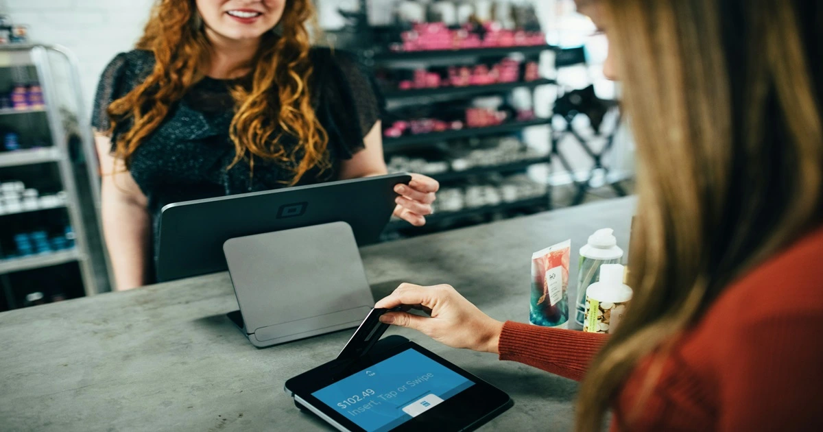 A person buying an item with their card.